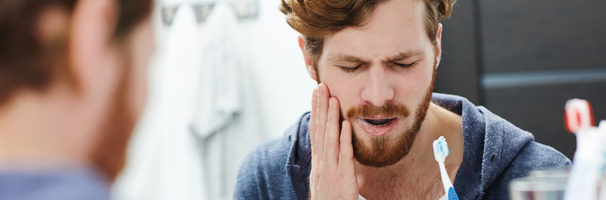 man-brushing-teeth-1242x411.jpg