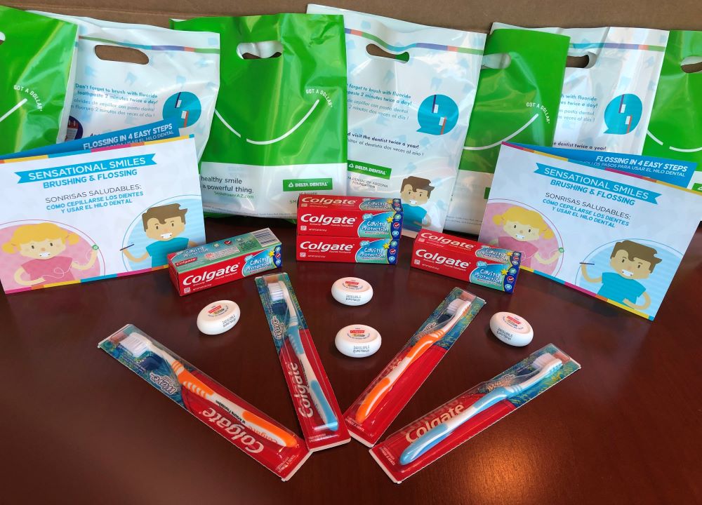 Delta Dental of Arizona Smile Bag items include a toothbrush, toothpaste, floss and an educational card 