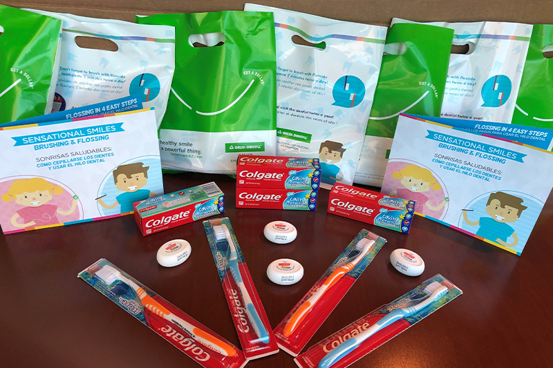 Delta Dental of Arizona Smile Bags include items like a toothbrush, toothpaste, floss and an educational card 