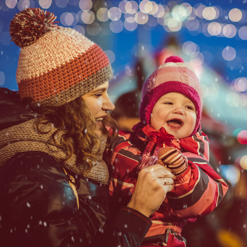 mom-holding-baby-outside-in-snow-800x800.jpg