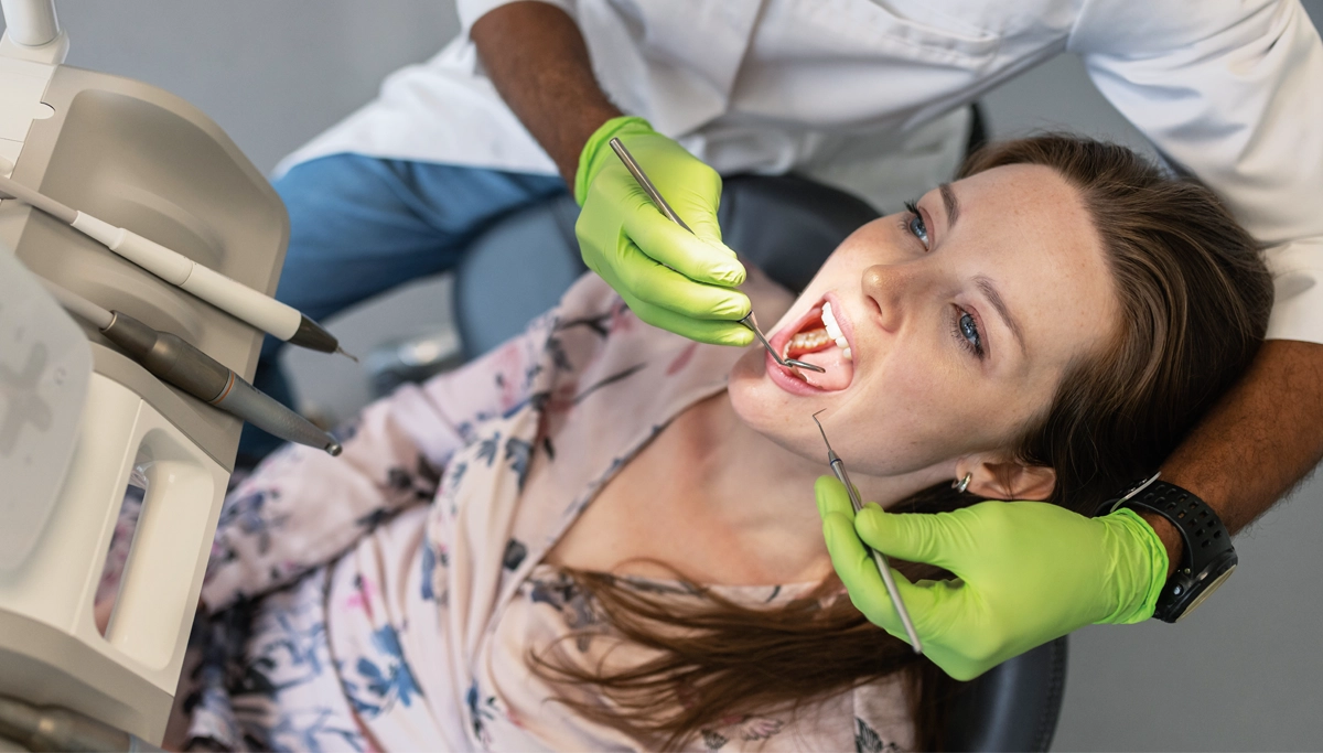 woman-getting-her-teeth-cleaned-1200x683.webp