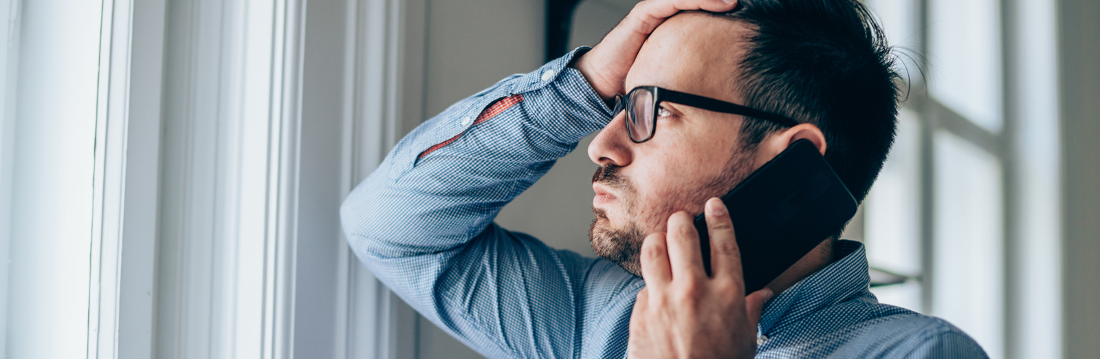 man-talking-on-phone-1600x522.jpg